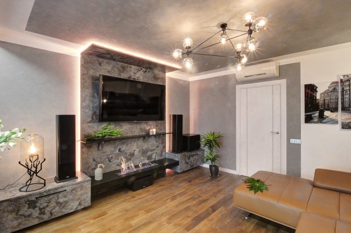 fireplace and TV in the interior of the living room in the apartment