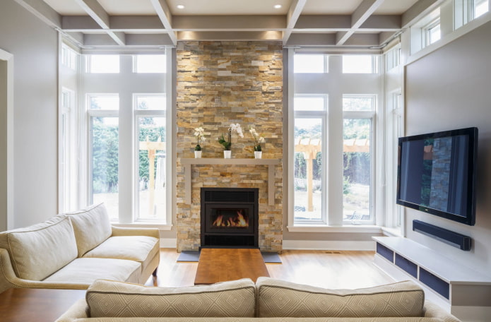 fireplace and TV in the interior of the living room in a country house