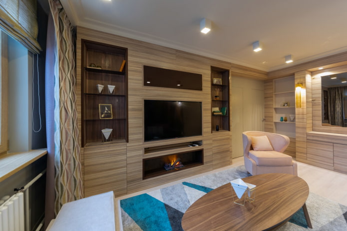 fireplace with TV built into the cabinet in the living room