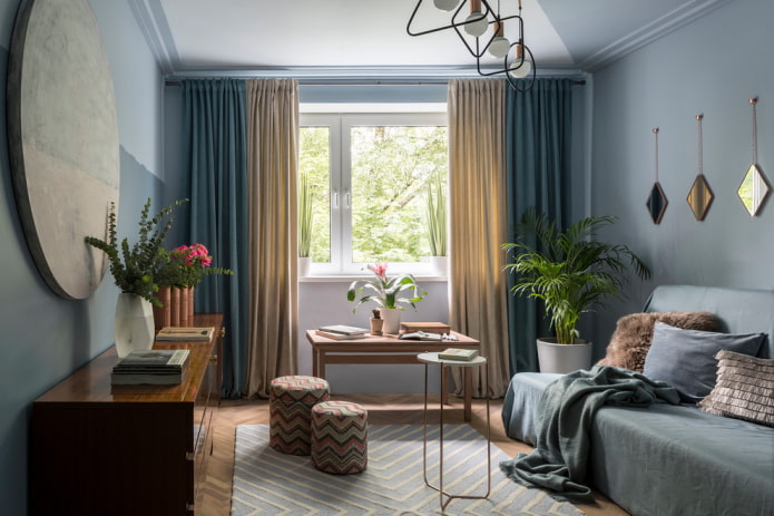 decor and textiles in the interior of a blue living room