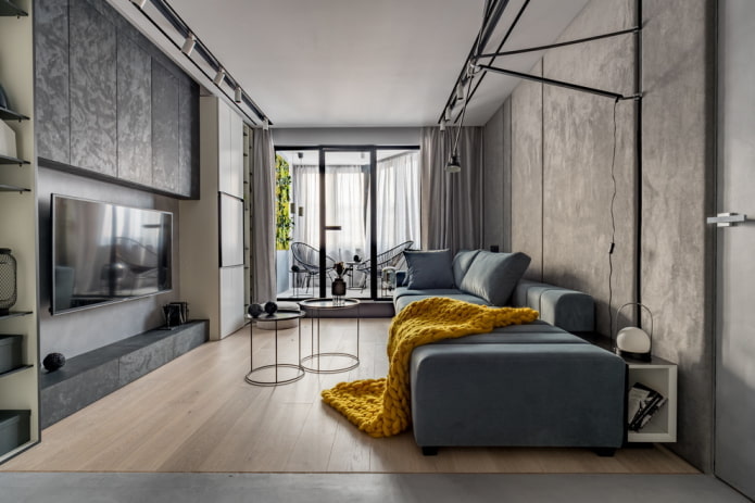 Gray living room with a bright blanket