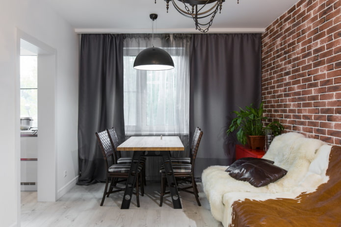Gray curtains, leather sofa and pillows
