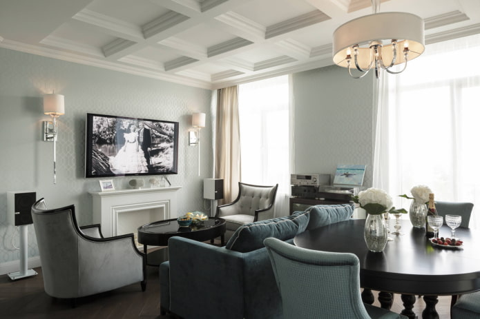 Chandelier above the table, wall sconces