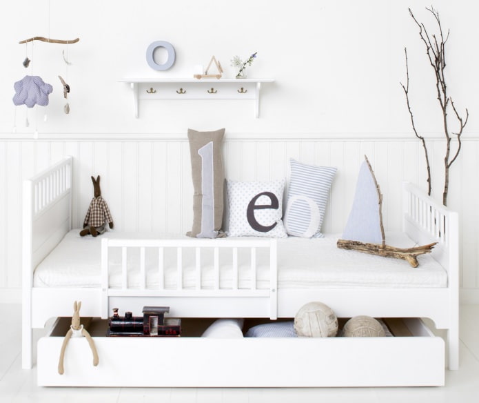 drawers in a bed for storing toys in a child's room