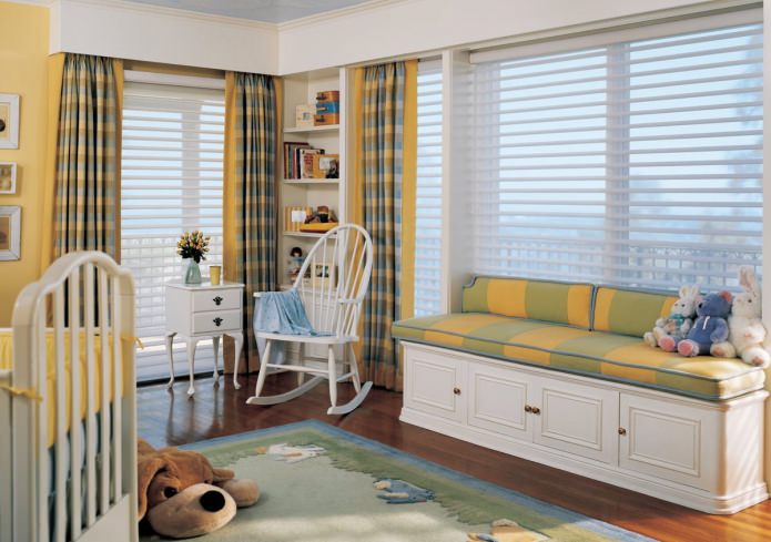 bench by the window for storing toys in the children's room