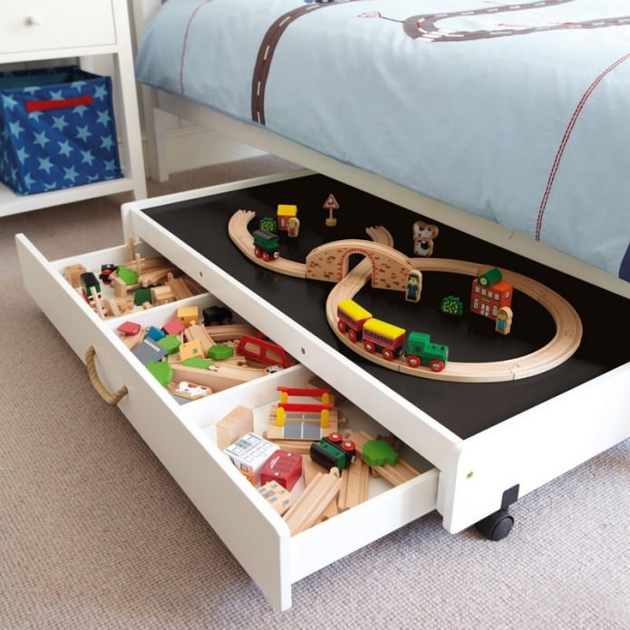 drawers in a bed for storing toys in a child's room