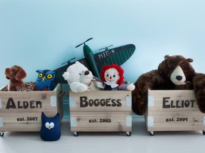 wooden boxes on wheels for storing toys in the children's room