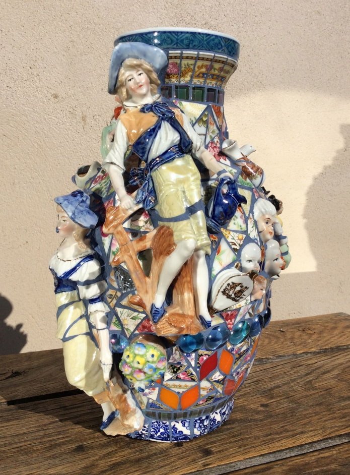 decorating a vase with shards of figurines