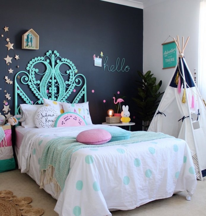 accent wall with a stylish headboard in the nursery