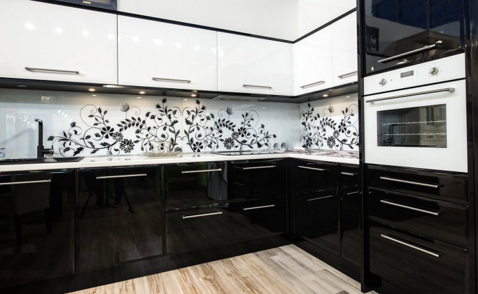 Black and white kitchen set with a pattern on the backsplash
