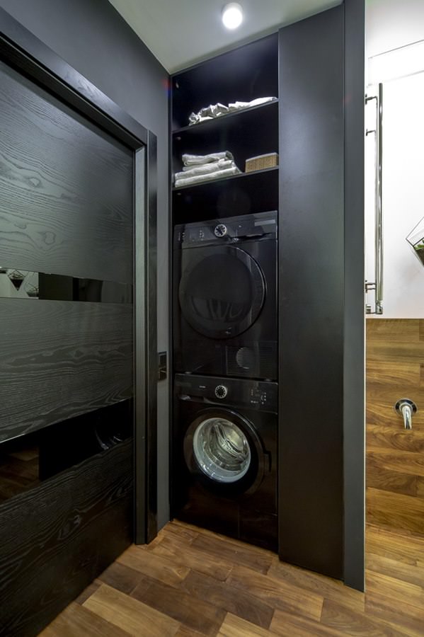 modern bathroom interior with washing machine and dryer