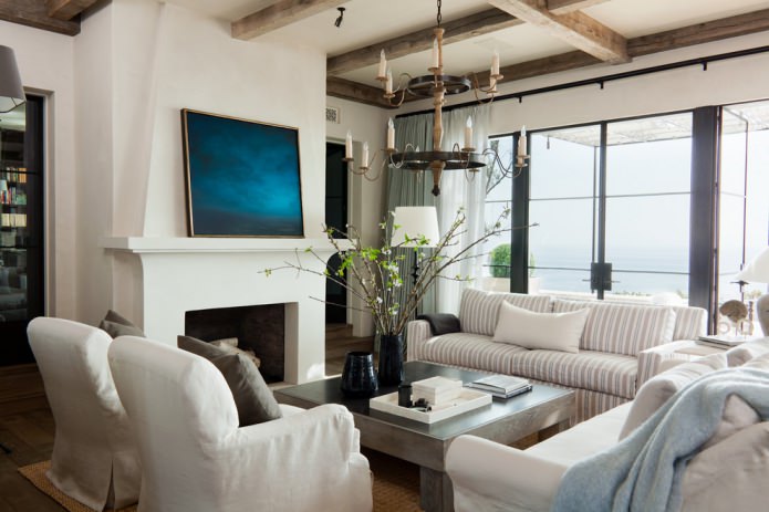 living room interior with decorative beams and wrought iron pendant lamp