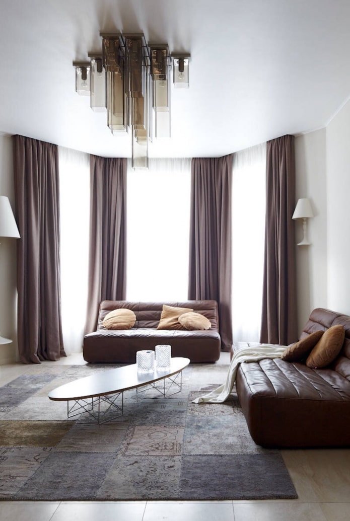 stretch ceiling in the living room with a bay window