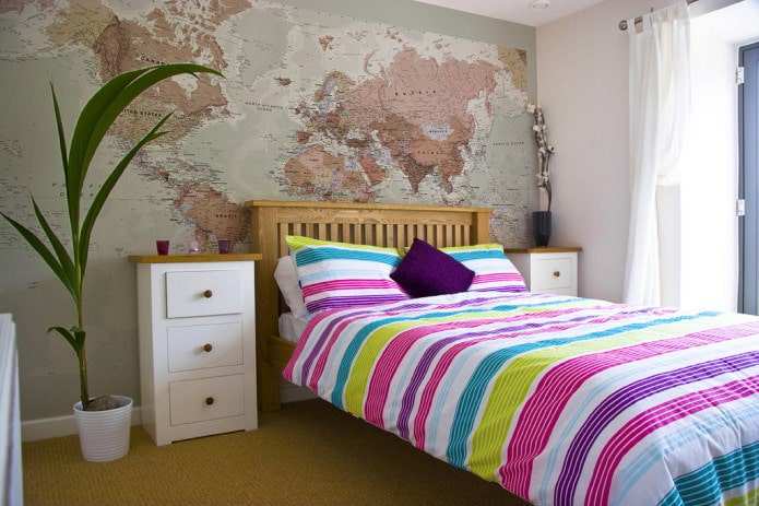 world map at the head of the bed