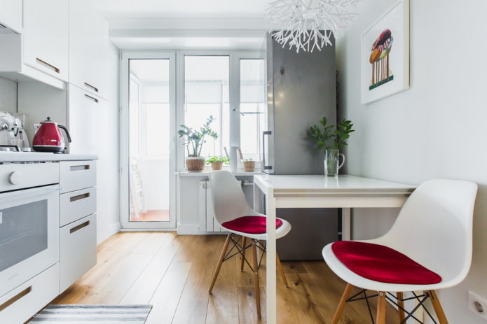 refrigerator on the opposite side of the kitchen