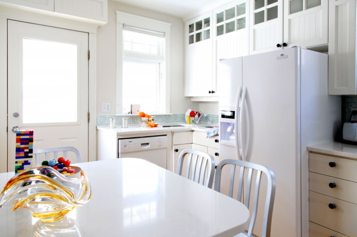refrigerator in the middle of the kitchen set