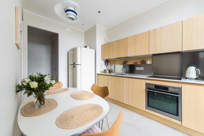 refrigerator by the entrance in the kitchen interior