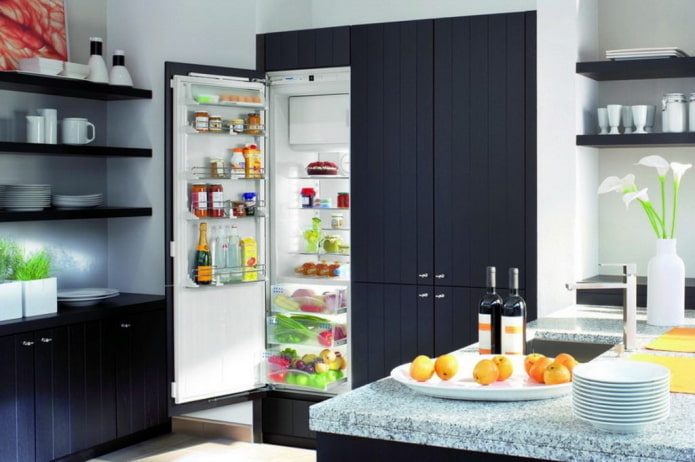 refrigerator in a cabinet in the kitchen interior