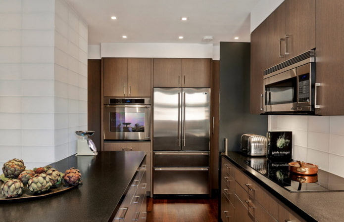 refrigerator in the middle of the kitchen set