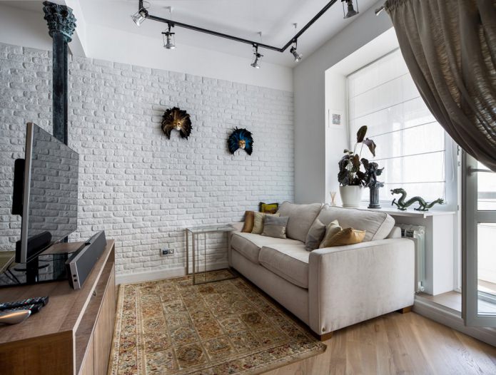 living room with white brick wallpaper