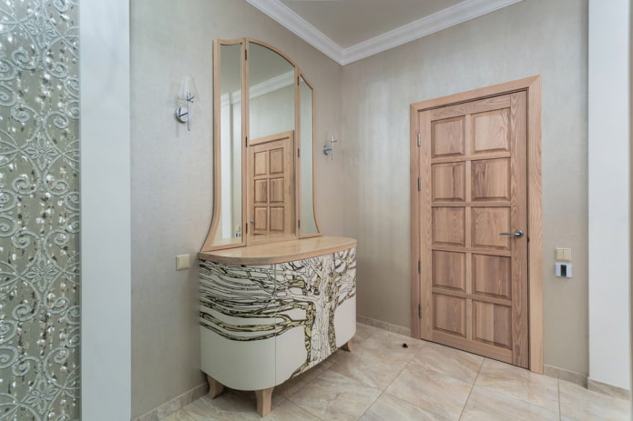 chest of drawers with a mirror in the interior of the hallway