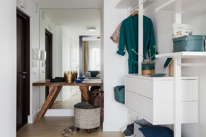 chest of drawers in the interior of a small hallway