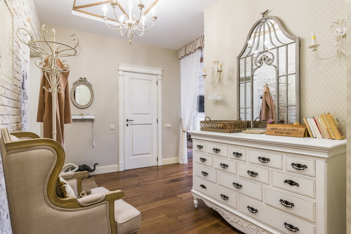 chest of drawers with a mirror in the interior of the hallway