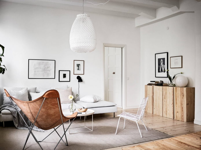 Living room in Scandinavian style with wooden chest of drawers
