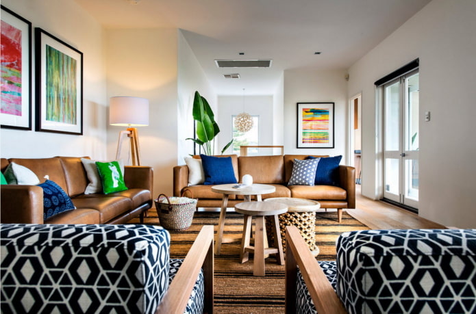 a combination of leather furniture with bright pillows