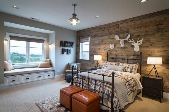 Bedroom with a wooden wall