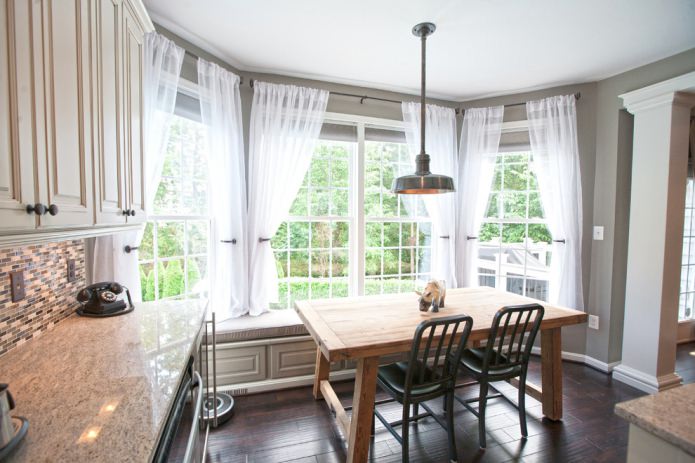 Classic short curtains in the kitchen interior
