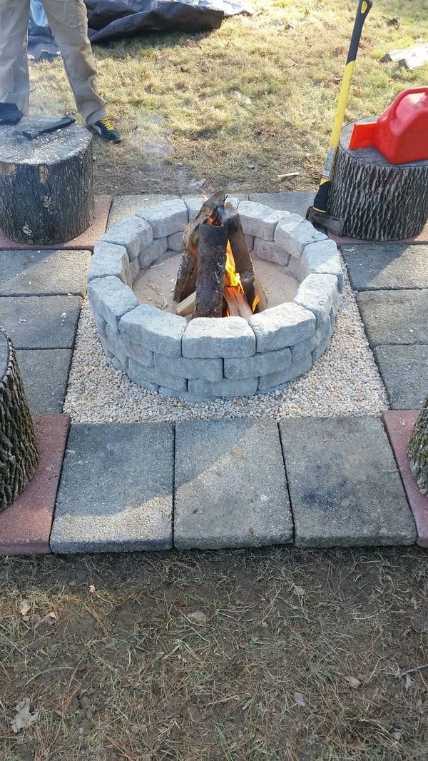 simple stone fire pit in the garden