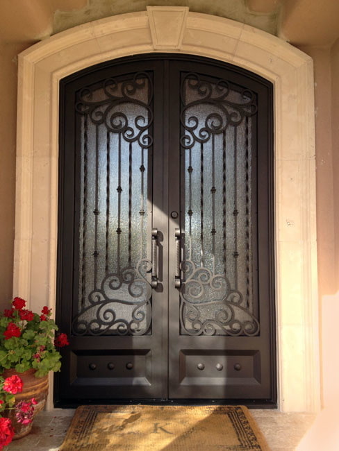 entrance door with forging and glass