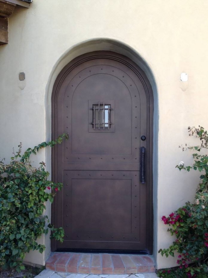 metal door with forged elements