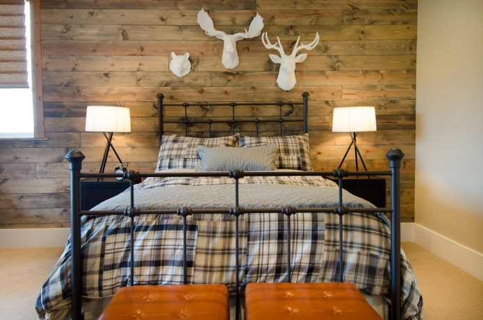 bed with forged headboard in the interior