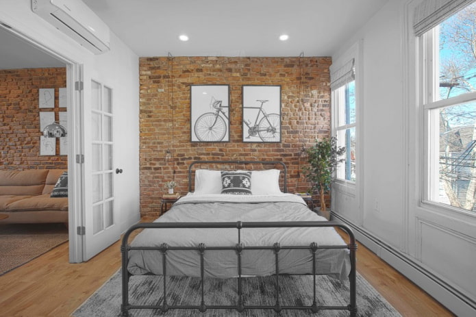 forged bed in a loft-style bedroom