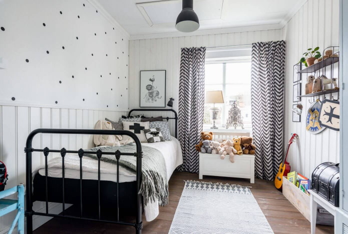 a bed with forged bed in a children's room in Scandinavian style