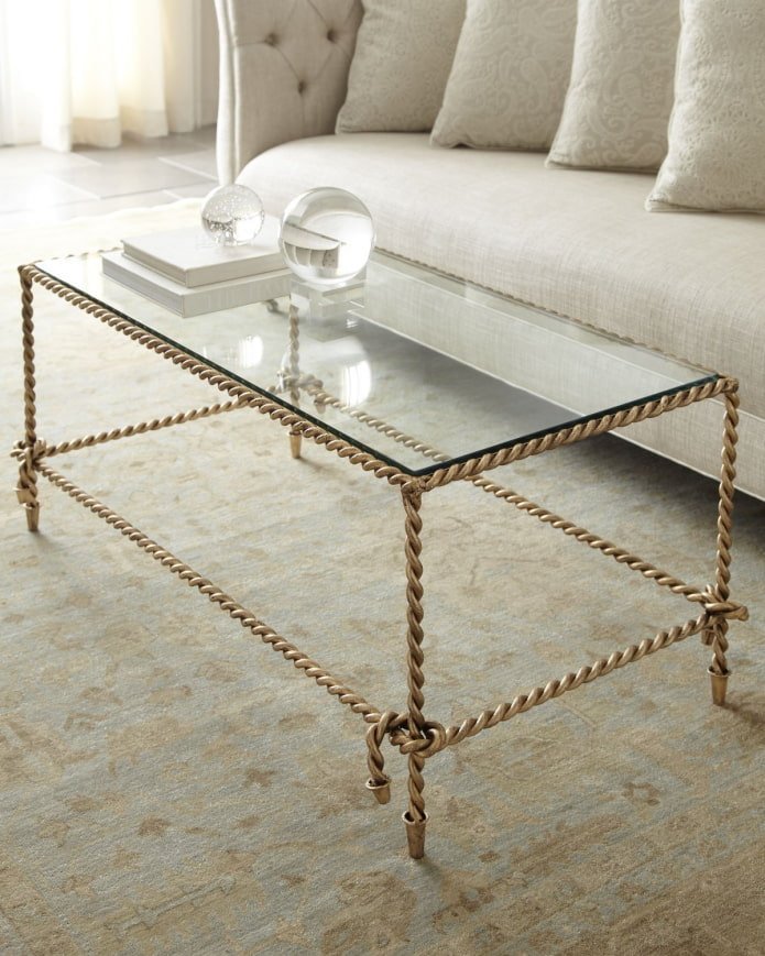 unusual wrought iron table with a glass top