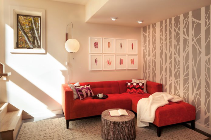beige wallpaper and a red sofa