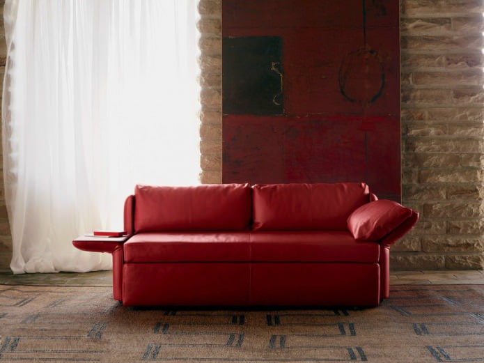 sofa with a table on the armrest
