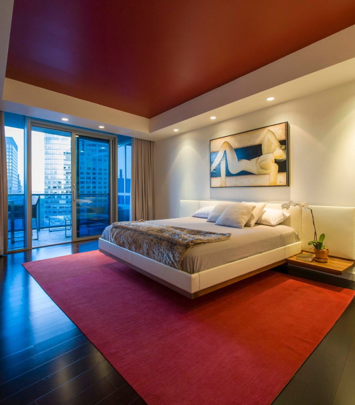 bedroom with a red carpet in the color of the ceiling