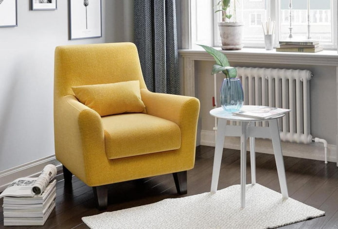 yellow armchair with a pillow