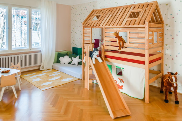 a bed in the form of a house with a ladder in a children's room