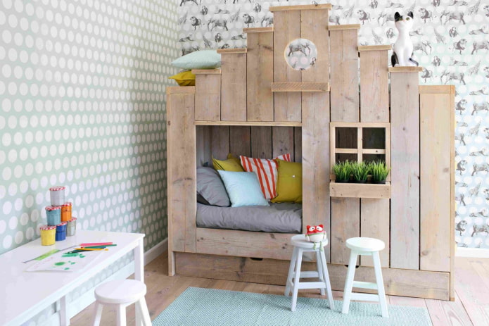 a bed in the form of a house in a nursery