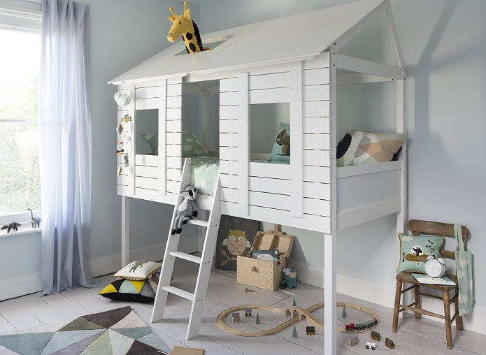 house-shaped bed with a play area in the nursery
