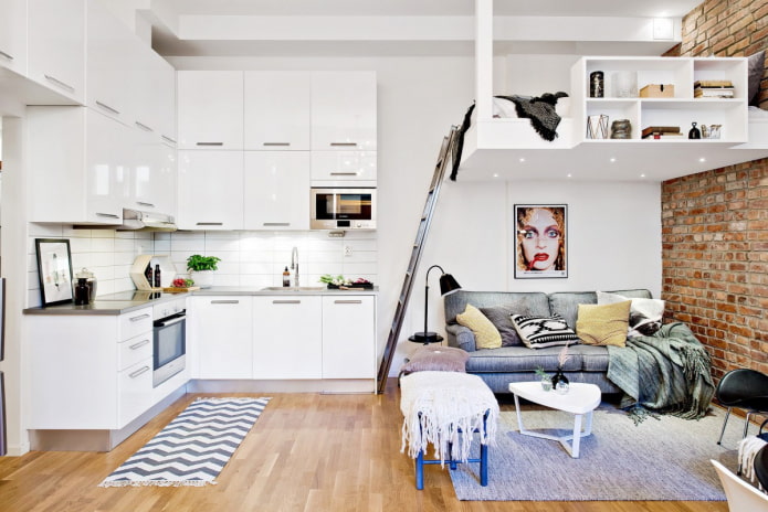 bed on the second level in the kitchen-living room