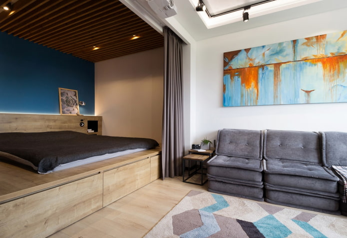 bed on a podium in the living room interior