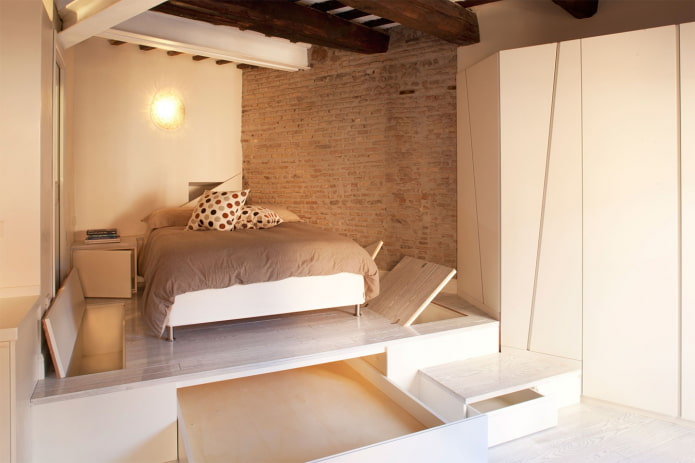 bed on a frame podium in the interior