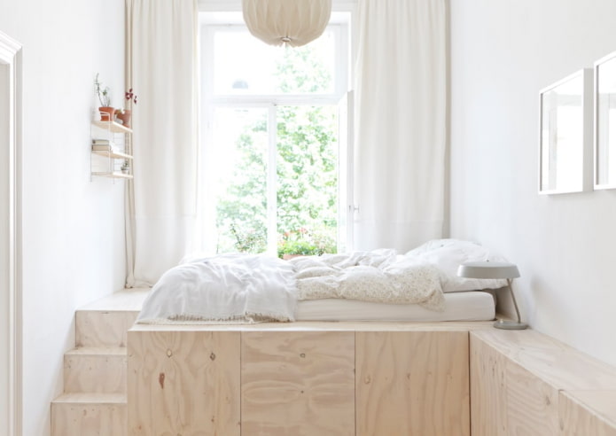 bed on a podium
