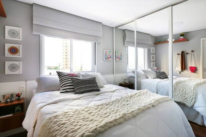 bed and mirrored wardrobe